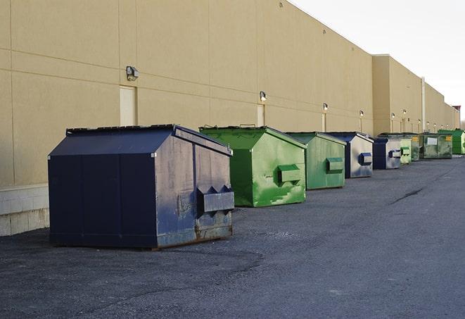 a stack of yellow construction dumpsters on a job site in Cross Plains IN